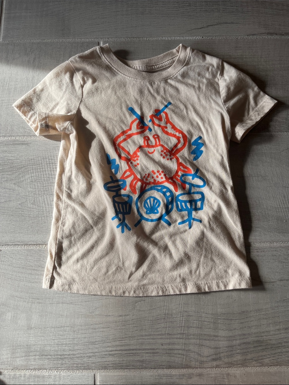 Cat & Jack Cream Short Sleeve Tee with Red Crab & Blue Drum Graphic